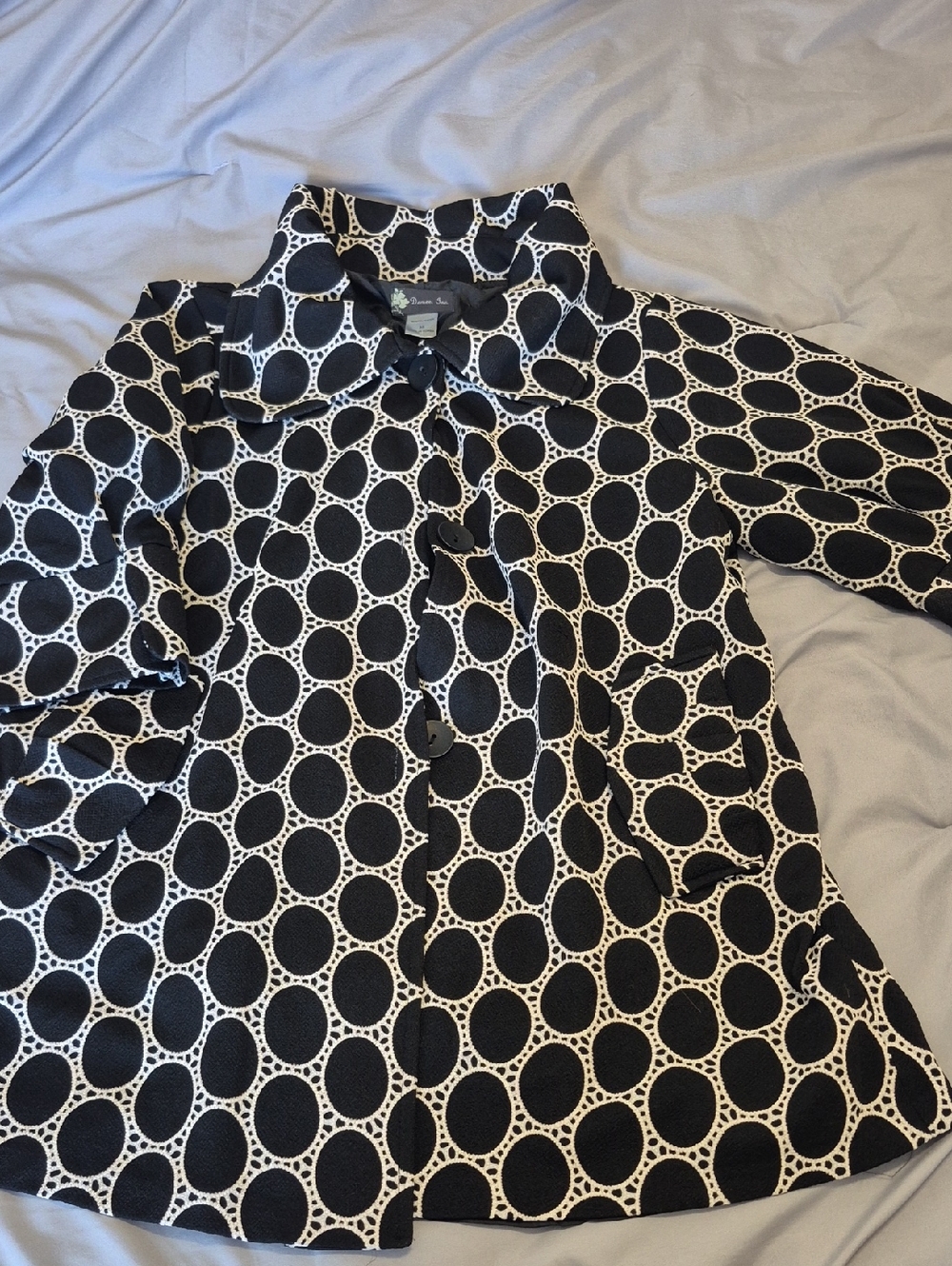 Size medium black and white patterned jacket or coat made by Damee